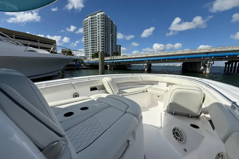  Yacht Photos Pics 2020 Sportsman Open 352 Center Console boat near a bridge and high-rise building.