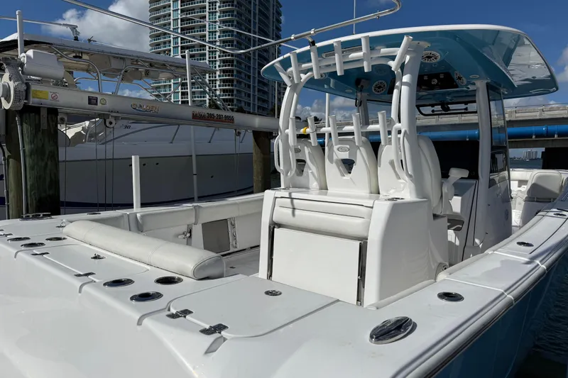  Yacht Photos Pics 2020 Sportsman Open 352 Center Console boat docked in marina, featuring modern seating and equipment.