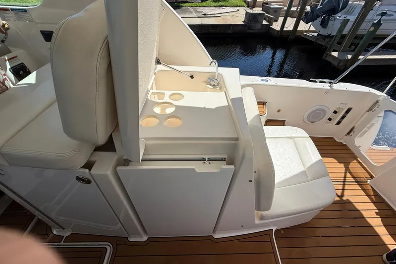 Blue Skys Yacht Photos Pics 2005 Tiara Yachts 3600 Sovran cockpit with seating and cup holders, dockside view.