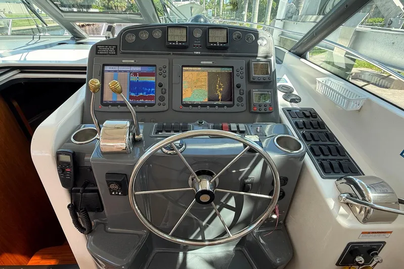 Blue Skys Yacht Photos Pics Helm of 2005 Tiara Yachts 3600 Sovran with navigation displays and controls.