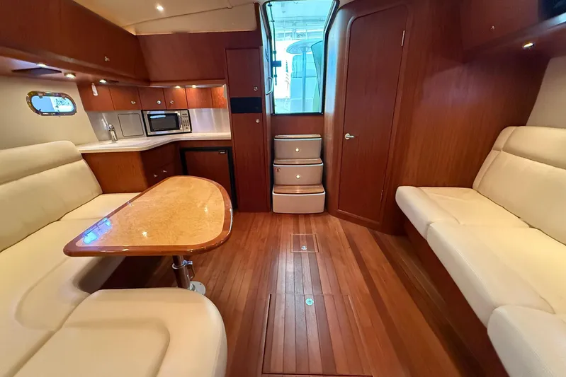 Blue Skys Yacht Photos Pics Luxurious interior of 2005 Tiara Yachts 3600 Sovran with wood finish and modern amenities.