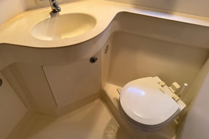 Blue Skys Yacht Photos Pics Bathroom interior of 2005 Tiara Yachts 3600 Sovran with sink and toilet.