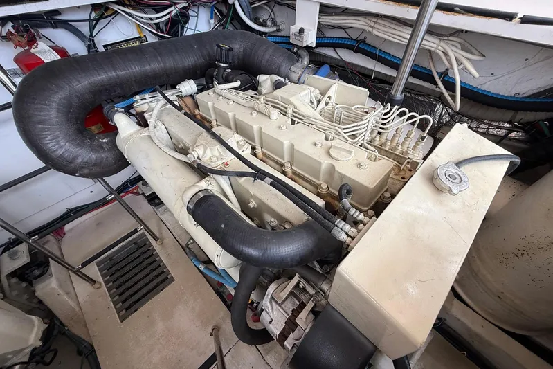 Blue Skys Yacht Photos Pics Engine room of a 2005 Tiara Yachts 3600 Sovran, showcasing detailed mechanical components.