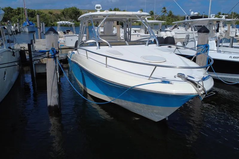  Yacht Photos Pics 2008 Hydra-Sports Vector 3300 VX boat docked at marina, blue and white hull.