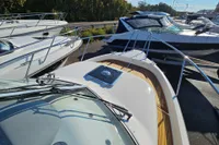 2008 Nimbus 27 Nova S boat with sleek design, docked among other vessels.