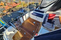 Spacious deck of 2008 Nimbus 27 Nova S with wooden flooring and cushioned seating.