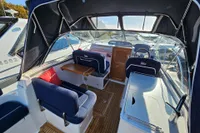Interior of 2008 Nimbus 27 Nova S boat with seating and helm.