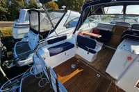 Nimbus 27 Nova S 2008 boat interior with wooden deck and seating area.