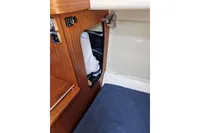 Interior cabin of 2008 Nimbus 27 Nova S boat with wooden paneling.