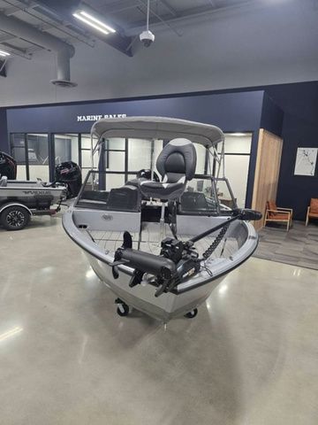 2024 Vexus ADX180 boat displayed indoors with modern design and equipment.