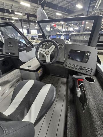 2024 Vexus ADX180 boat interior with steering wheel and navigation system.