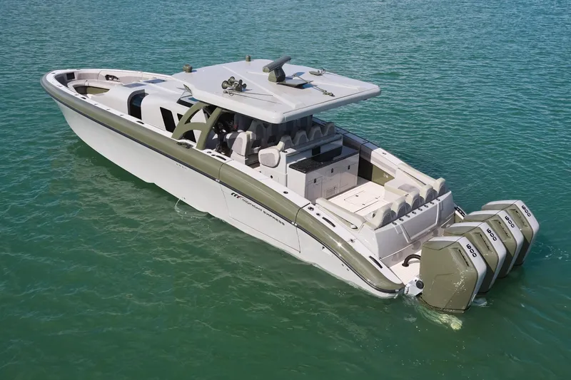  Yacht Photos Pics 2025 Midnight Express 52' Vitesse luxury boat on clear water, featuring triple outboard engines.