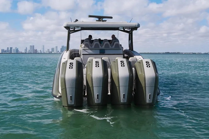  Yacht Photos Pics 2025 Midnight Express 52' Vitesse boat with five powerful engines on open water.