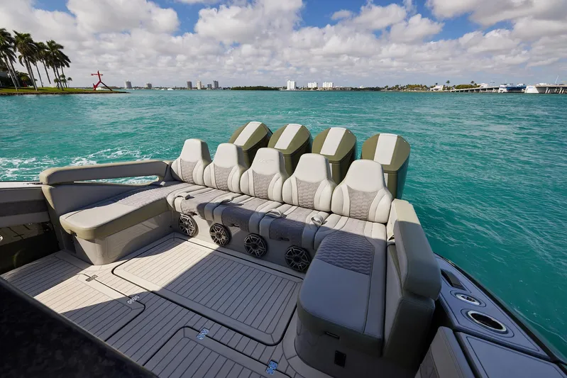  Yacht Photos Pics 2025 Midnight Express 52' Vitesse luxury boat interior with seating, cruising on turquoise waters.