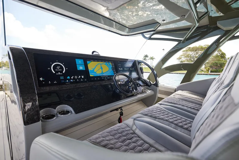  Yacht Photos Pics 2025 Midnight Express 52' Vitesse yacht cockpit with advanced navigation displays and luxurious seating.