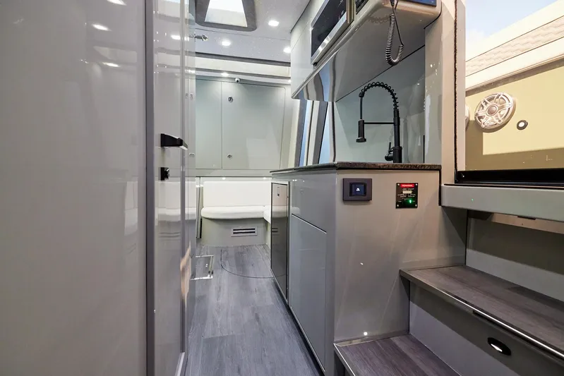  Yacht Photos Pics Luxurious interior of 2025 Midnight Express 52' Vitesse yacht, featuring modern kitchen and sleek design.