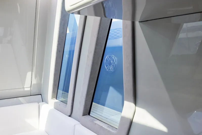  Yacht Photos Pics Interior view of 2025 Midnight Express 52' Vitesse yacht with modern windows and seating.