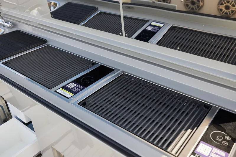  Yacht Photos Pics 2025 Midnight Express 52' Vitesse yacht interior with sleek, modern grill and control panels.