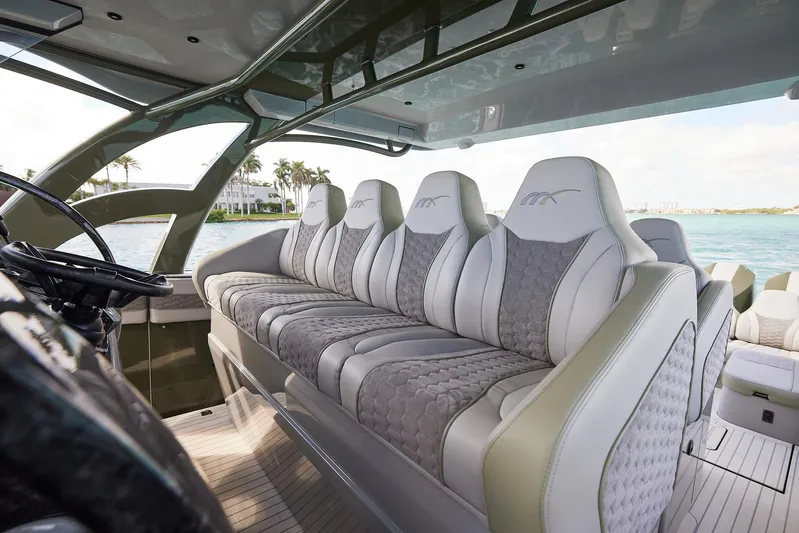  Yacht Photos Pics Luxurious interior seating of 2025 Midnight Express 52' Vitesse yacht, featuring elegant design.