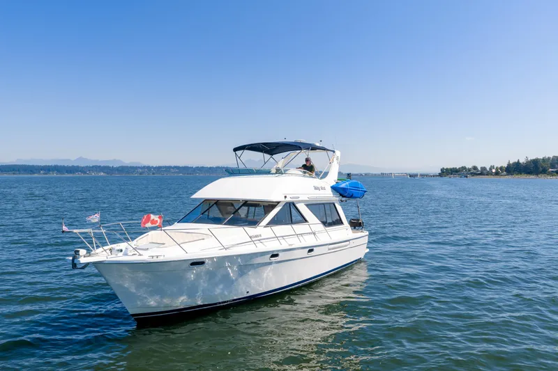  Yacht Photos Pics 1997 Bayliner 3988 yacht cruising on a sunny day in open waters.