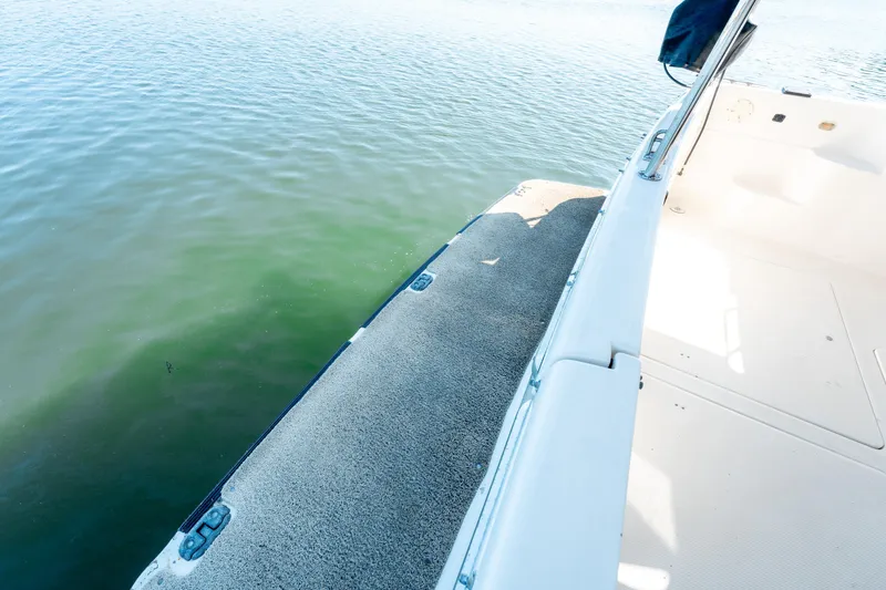  Yacht Photos Pics 1997 Bayliner 3988 boat deck with water view, featuring clean white surfaces.