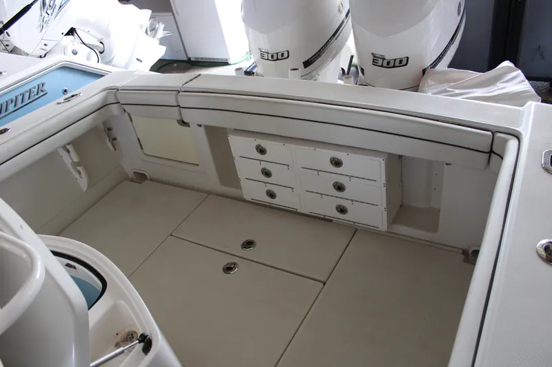 Yacht Photos Pics 2018 Jupiter 30 HFS boat interior with storage compartments and twin outboard engines.