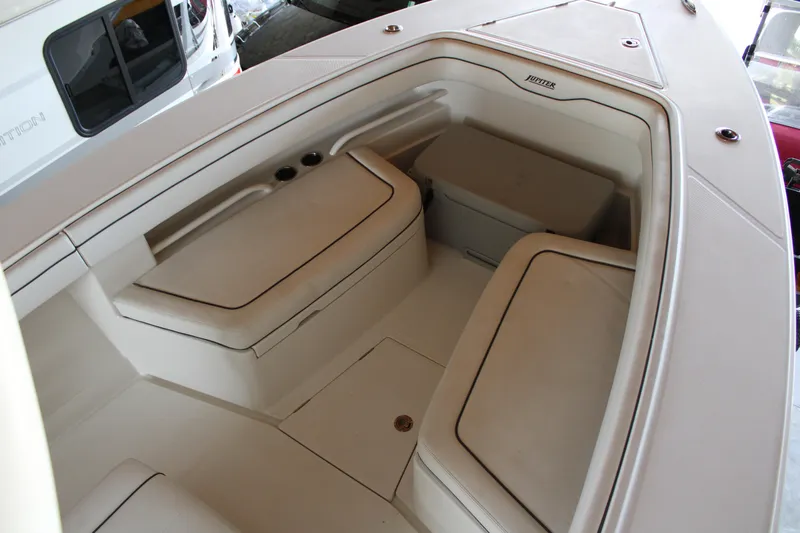  Yacht Photos Pics 2018 Jupiter 30 HFS boat interior with cushioned seating and storage compartments.