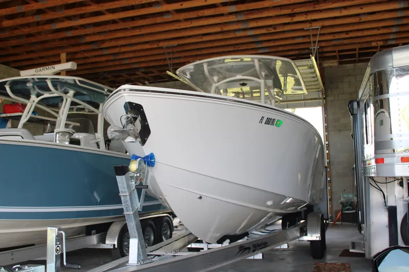  Yacht Photos Pics 2018 Jupiter 30 HFS boat on trailer in storage facility.