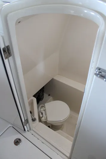  Yacht Photos Pics 2018 Jupiter 30 HFS boat interior with compact marine toilet.