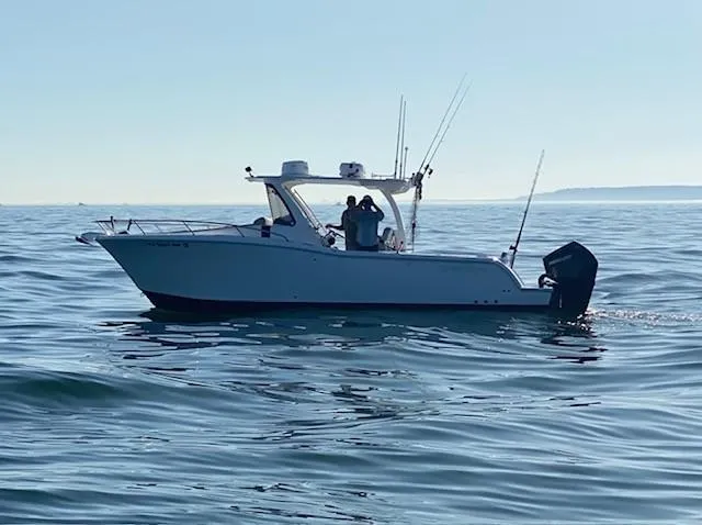  Yacht Photos Pics 2020 Belzona 27 Walkaround boat cruising on calm ocean waters.