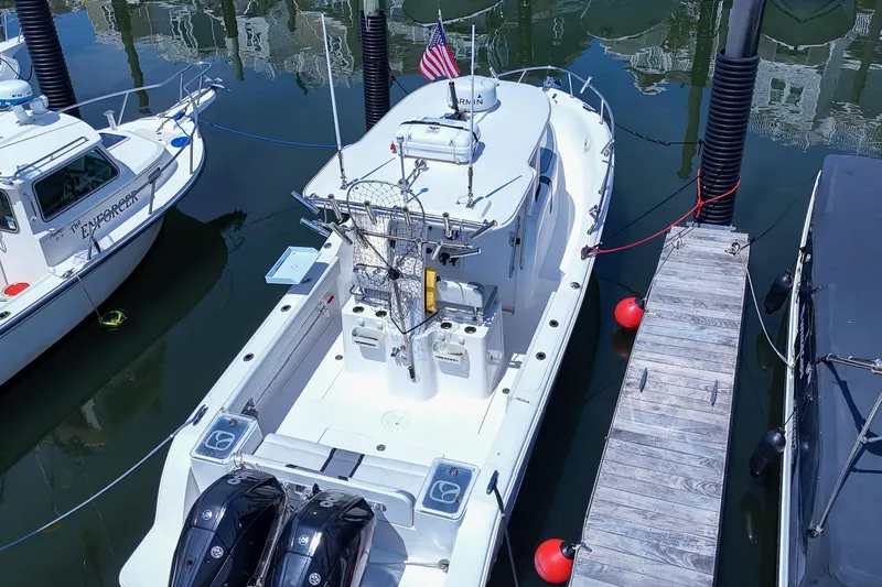  Yacht Photos Pics 2020 Belzona 27 Walkaround boat docked, aerial view, with twin engines and American flag.