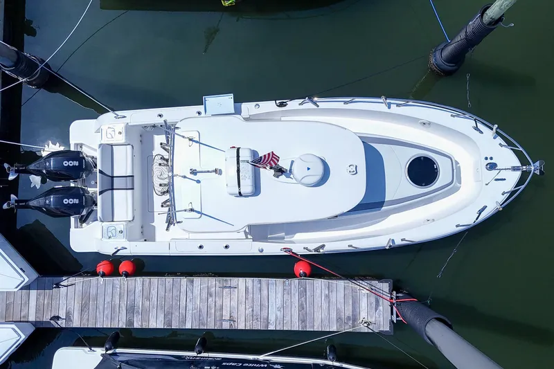  Yacht Photos Pics Aerial view of 2020 Belzona 27 Walkaround boat docked, featuring dual engines and sleek design.