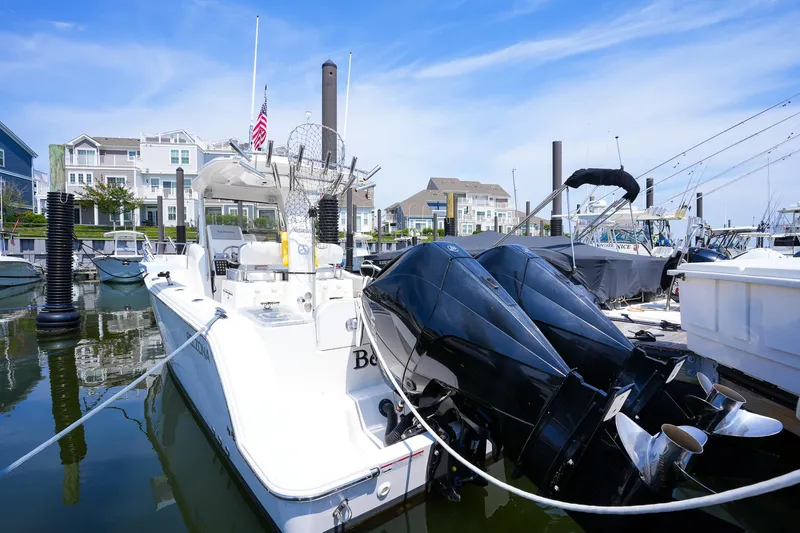  Yacht Photos Pics 2020 Belzona 27 Walkaround boat docked in a marina with twin engines.