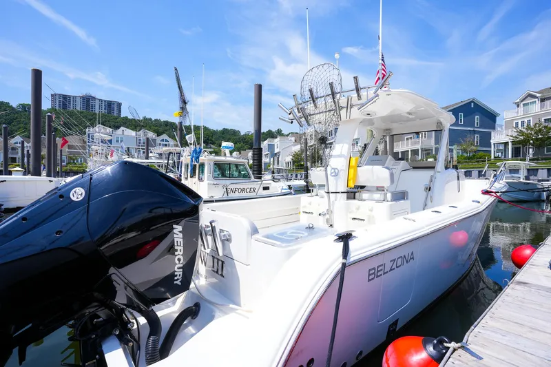  Yacht Photos Pics 2020 Belzona 27 Walkaround boat docked, featuring Mercury engine, in a marina setting.