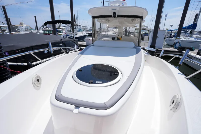  Yacht Photos Pics 2020 Belzona 27 Walkaround boat docked at marina, showcasing sleek design and spacious deck.