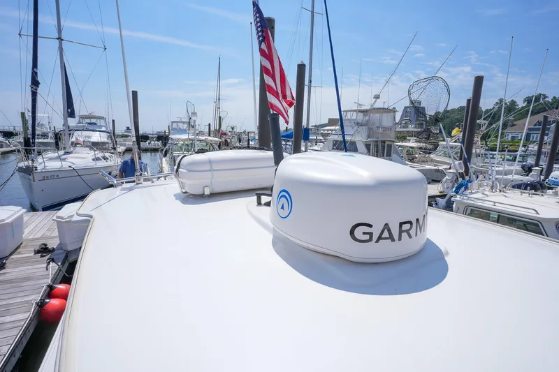  Yacht Photos Pics 2020 Belzona 27 Walkaround boat docked with Garmin equipment and American flag.