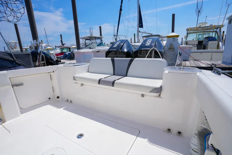  Yacht Photos Pics 2020 Belzona 27 Walkaround boat with seating, docked at marina under clear blue sky.