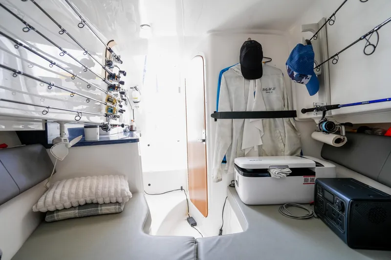  Yacht Photos Pics Interior of a 2020 Belzona 27 Walkaround boat with fishing gear and seating.