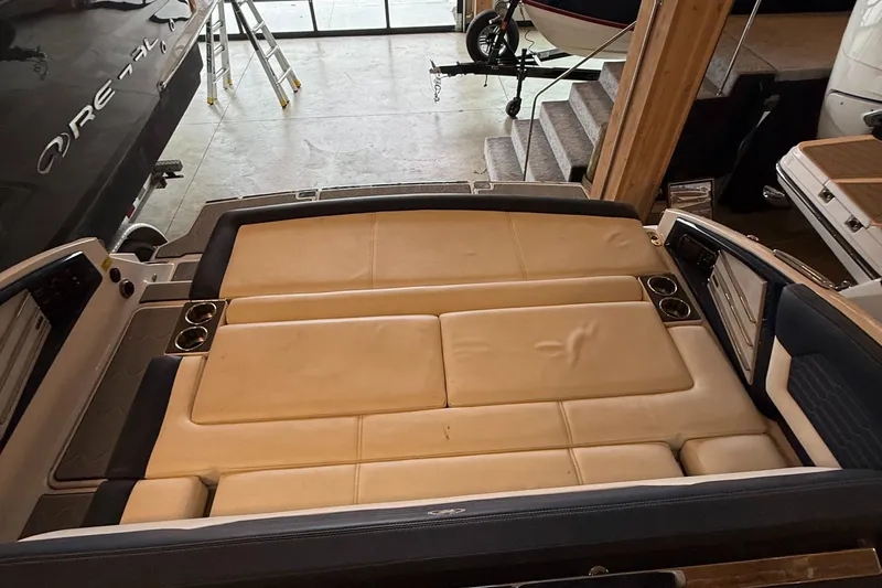  Yacht Photos Pics 2020 Cobalt A29 boat interior with beige seating and cup holders.