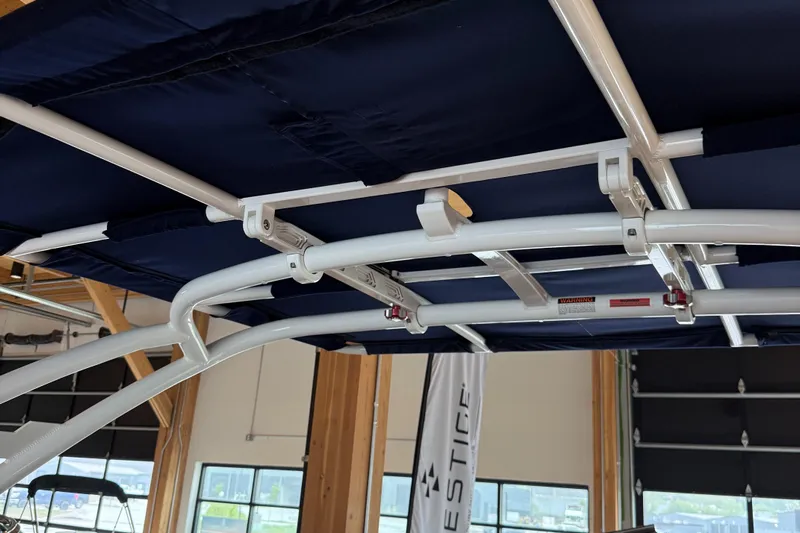  Yacht Photos Pics 2020 Cobalt A29 boat canopy frame in a showroom setting.