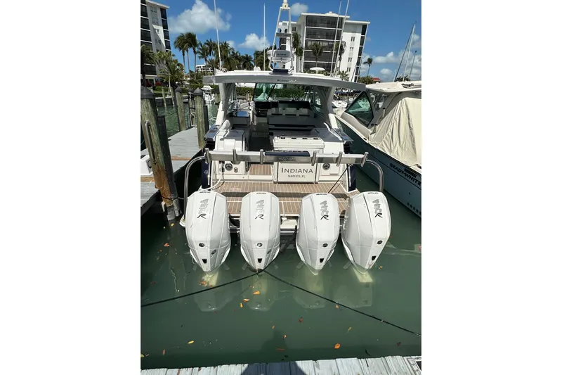  Yacht Photos Pics 2023 Formula 430 All Sport Crossover boat docked with four powerful outboard engines.