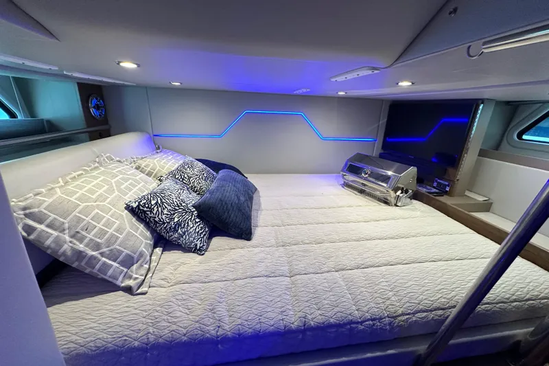  Yacht Photos Pics Luxurious interior of 2023 Formula 430 All Sport Crossover with modern bedding and ambient lighting.