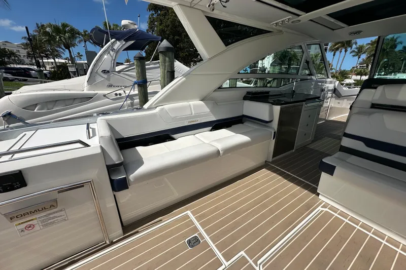  Yacht Photos Pics 2023 Formula 430 All Sport Crossover boat interior with seating and sleek design.