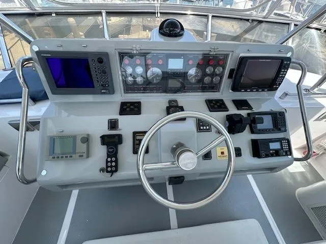 Sand Castle Yacht Photos Pics Cockpit of 1996 Johnson 70 Euro yacht with navigation instruments and steering wheel.