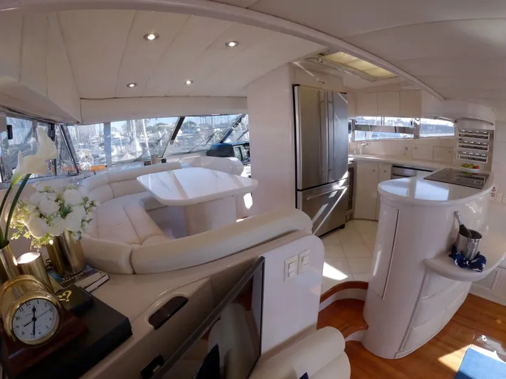 Sand Castle Yacht Photos Pics Luxurious interior of a 1996 Johnson 70 Euro yacht with modern kitchen and seating area.