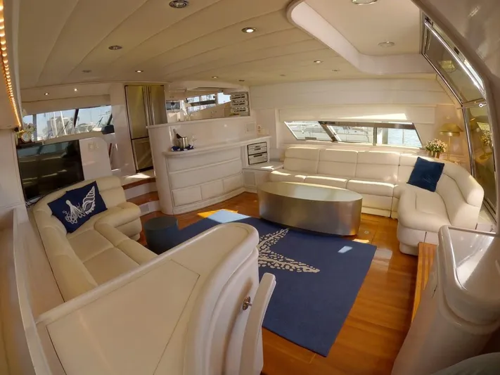Sand Castle Yacht Photos Pics Luxurious interior of a 1996 Johnson 70 Euro yacht with white leather seating.