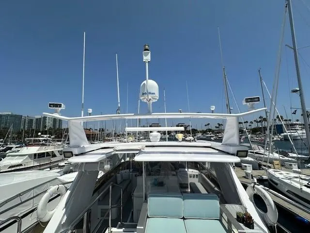 Sand Castle Yacht Photos Pics Luxury Johnson 70 Euro yacht docked at marina, 1996 model, clear blue sky.