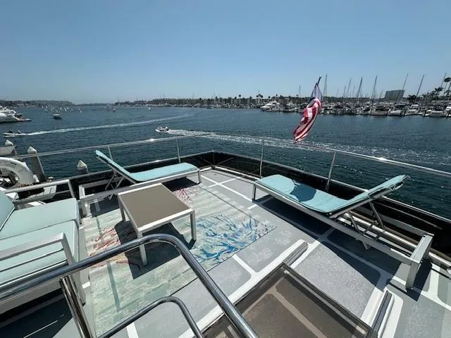 Sand Castle Yacht Photos Pics Sunny deck of 1996 Johnson 70 Euro yacht with loungers and ocean view.