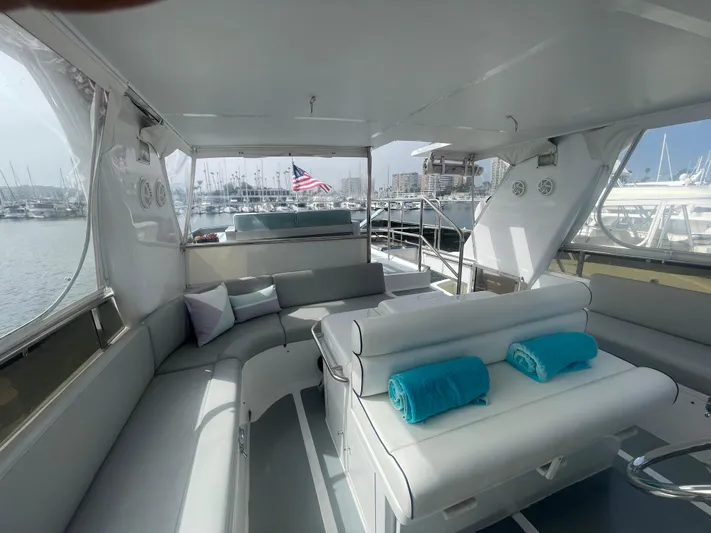 Sand Castle Yacht Photos Pics Luxurious 1996 Johnson 70 Euro yacht interior with plush seating and marina view.