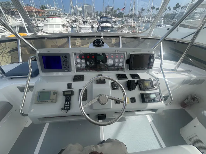 Sand Castle Yacht Photos Pics Cockpit of a 1996 Johnson 70 Euro yacht with navigation equipment and steering wheel.